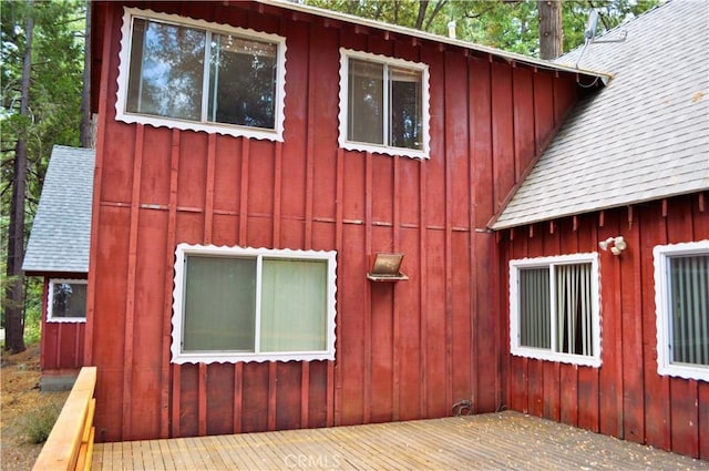 view of side of home with a wooden deck