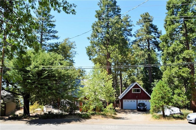 view of front of house featuring an outbuilding