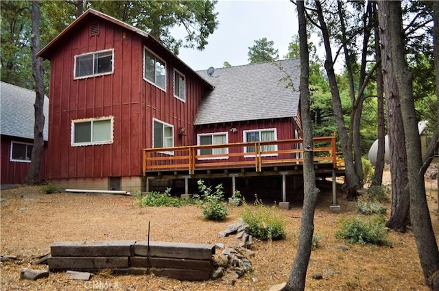 rear view of property with a deck