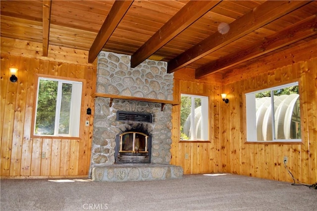 unfurnished living room with wooden ceiling, a fireplace, and a wealth of natural light