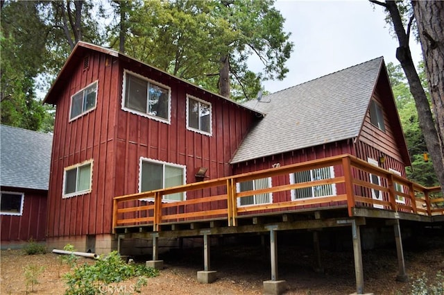 back of house featuring a wooden deck