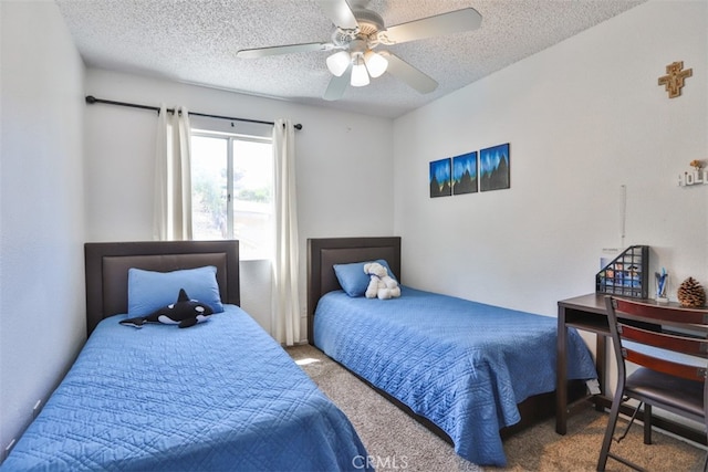 bedroom featuring a textured ceiling, carpet floors, and ceiling fan