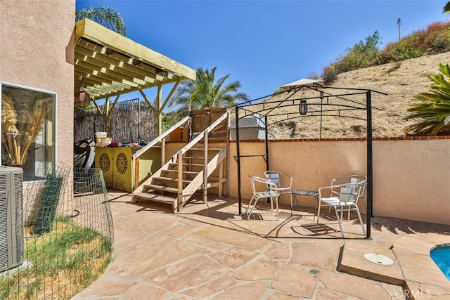 view of patio with a gazebo and central AC unit