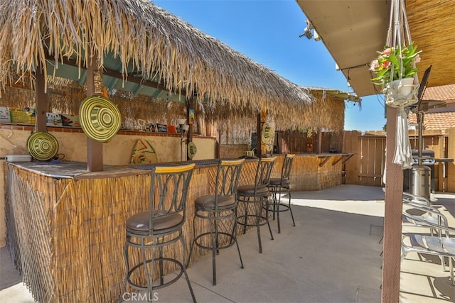 bar featuring concrete floors