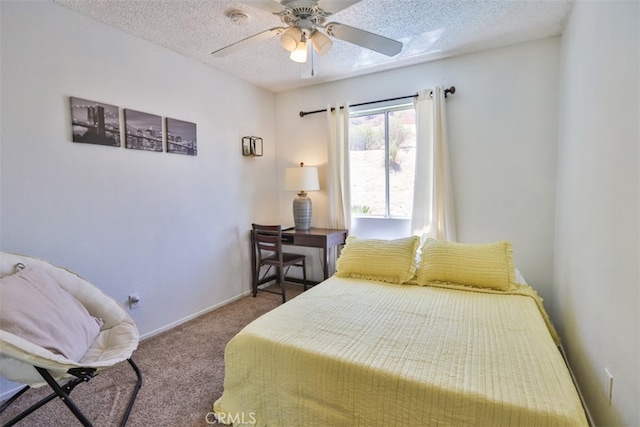 carpeted bedroom with a textured ceiling and ceiling fan