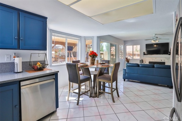 tiled dining room with ceiling fan