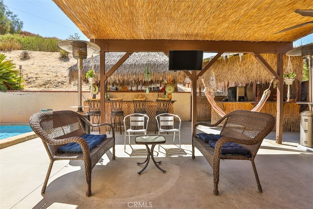 view of patio with a gazebo and a bar