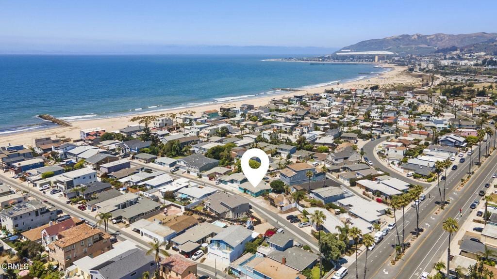 aerial view with a view of the beach and a water view