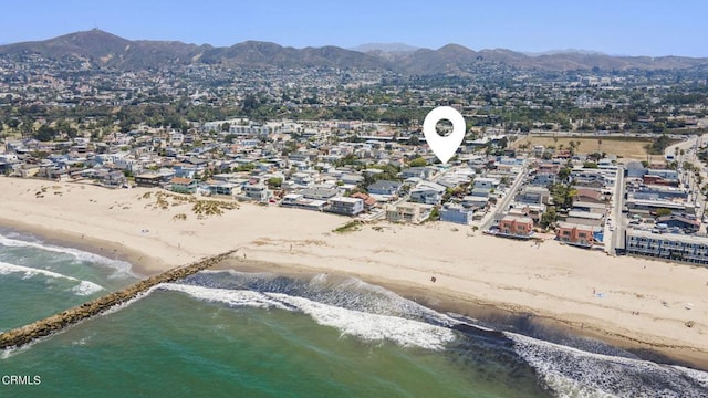 bird's eye view featuring a beach view and a water and mountain view