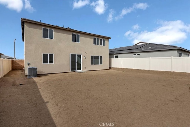 back of property featuring central AC unit