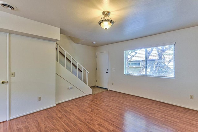 unfurnished living room with hardwood / wood-style floors