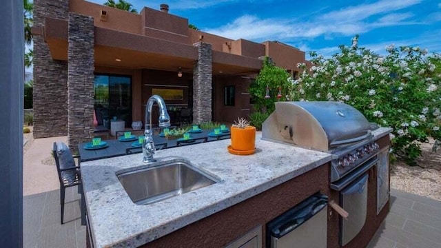 view of patio with exterior kitchen and sink