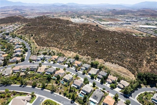 birds eye view of property with a mountain view