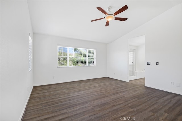 spare room featuring ceiling fan, lofted ceiling, and dark wood-type flooring