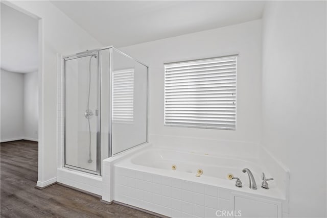 bathroom featuring separate shower and tub and hardwood / wood-style floors