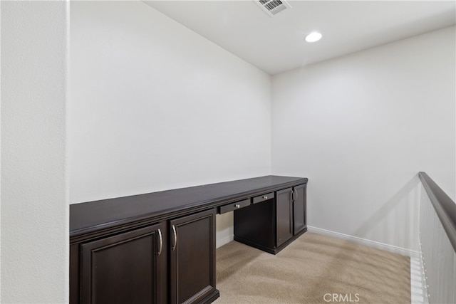 unfurnished office with light colored carpet