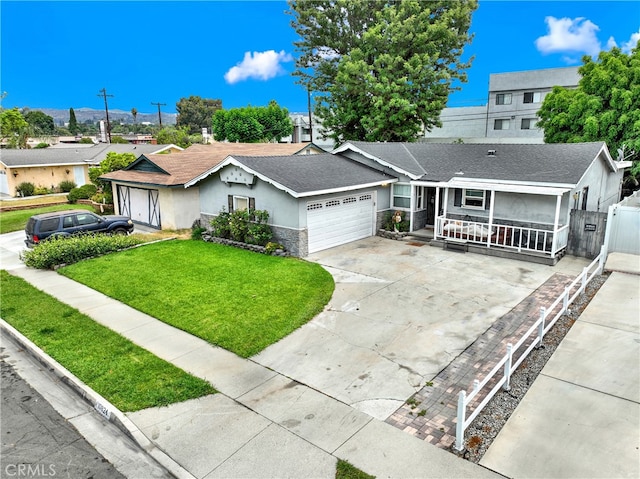 ranch-style home with a front yard, a porch, and a garage