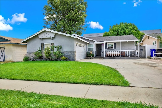 ranch-style home featuring a porch, a garage, and a front lawn