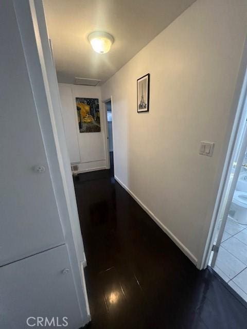 corridor with dark wood-type flooring