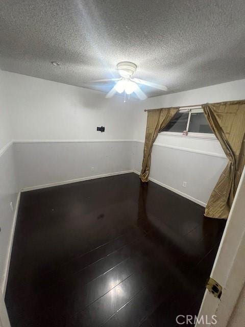 unfurnished room featuring a textured ceiling