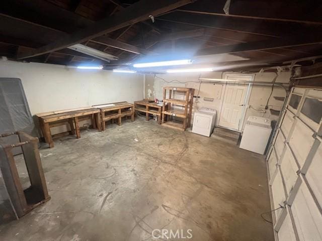 basement with a workshop area and washer / clothes dryer