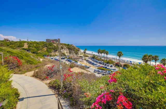 exterior space with a beach view and a water view