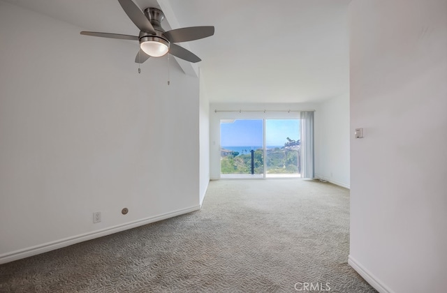 empty room featuring ceiling fan and carpet flooring