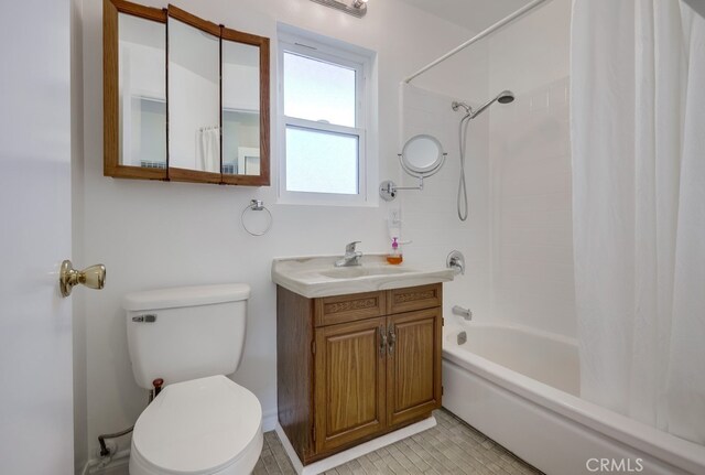 full bath featuring tile patterned floors, toilet, shower / tub combo with curtain, and vanity