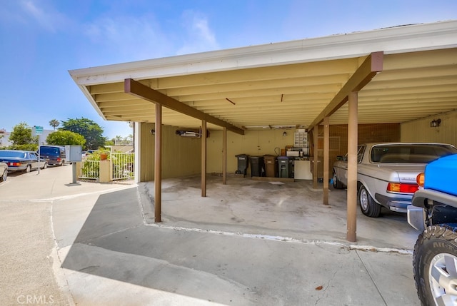 view of parking / parking lot with a carport