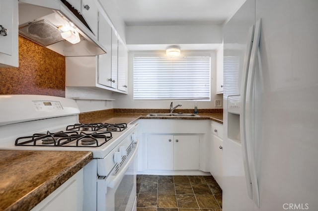 kitchen featuring sink, white appliances, and white cabinets