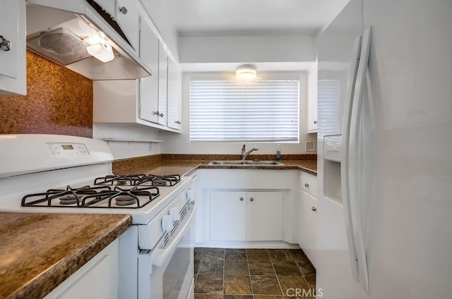 kitchen featuring a sink, white cabinetry, under cabinet range hood, white appliances, and dark countertops
