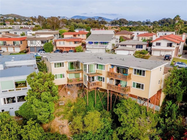 drone / aerial view with a residential view and a mountain view