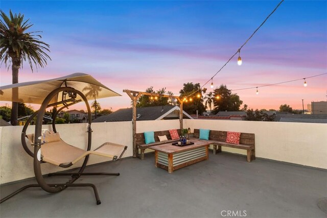 view of patio terrace at dusk