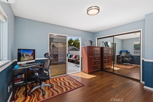 office space with wood-type flooring