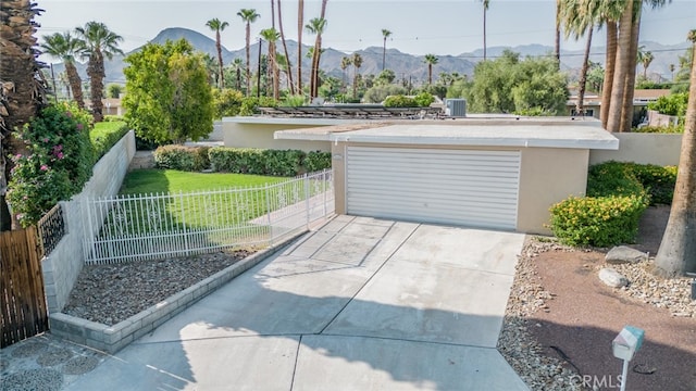 exterior space with a yard and a mountain view