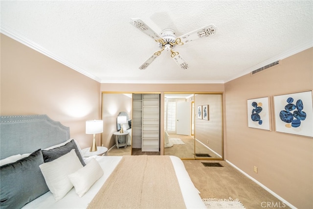 bedroom featuring crown molding, light colored carpet, a closet, and ceiling fan