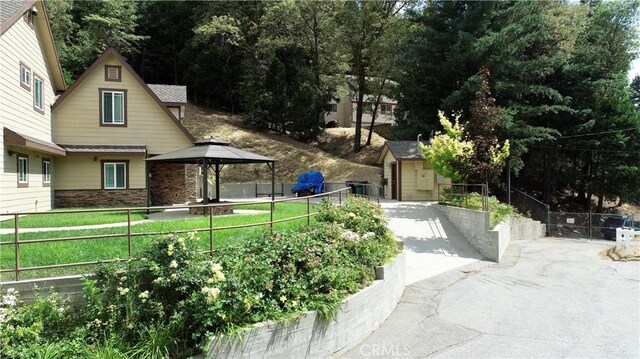 919 Venus Way, Crestline, CA 92325 - exterior space featuring a storage unit, fence, an outdoor structure, and a gazebo