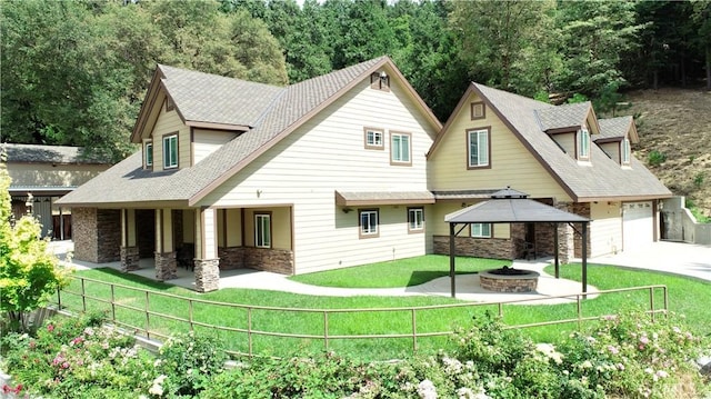 919 Venus Way, Crestline, CA 92325 - exterior space featuring a fire pit, stone siding, fence, a gazebo, and a front yard