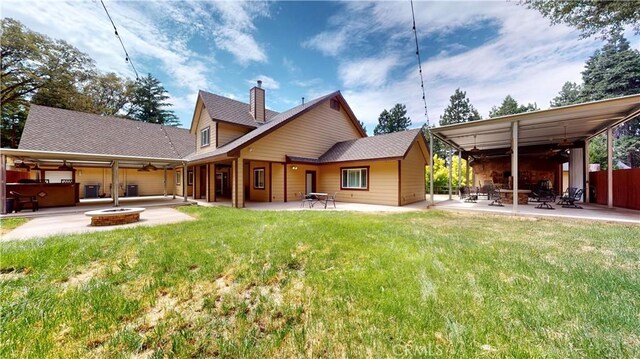919 Venus Way, Crestline, CA 92325 - rear view of property featuring a yard, a patio, a chimney, and ceiling fan