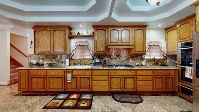 919 Venus Way, Crestline, CA 92325 - kitchen featuring brown cabinets, a tray ceiling, and light countertops