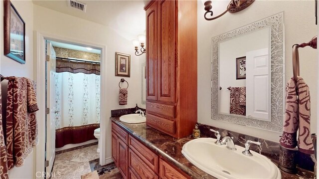 919 Venus Way, Crestline, CA 92325 - bathroom with visible vents, a sink, toilet, and double vanity