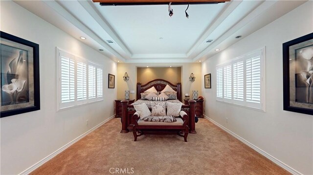 919 Venus Way, Crestline, CA 92325 - bedroom featuring light carpet, multiple windows, a raised ceiling, and baseboards