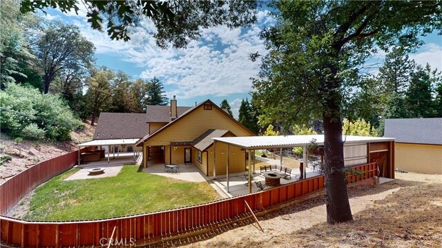 919 Venus Way, Crestline, CA 92325 - rear view of property featuring a fenced backyard, a lawn, and a patio