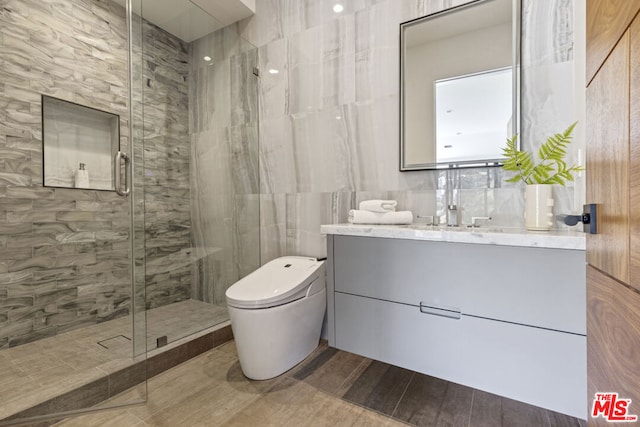 bathroom with vanity, toilet, and an enclosed shower