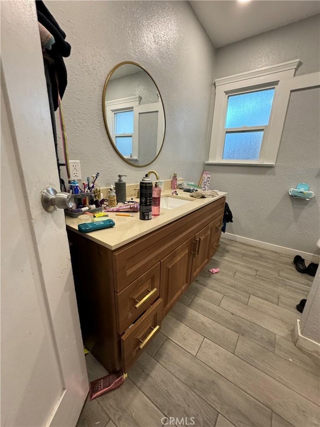 bathroom with wood-type flooring and vanity