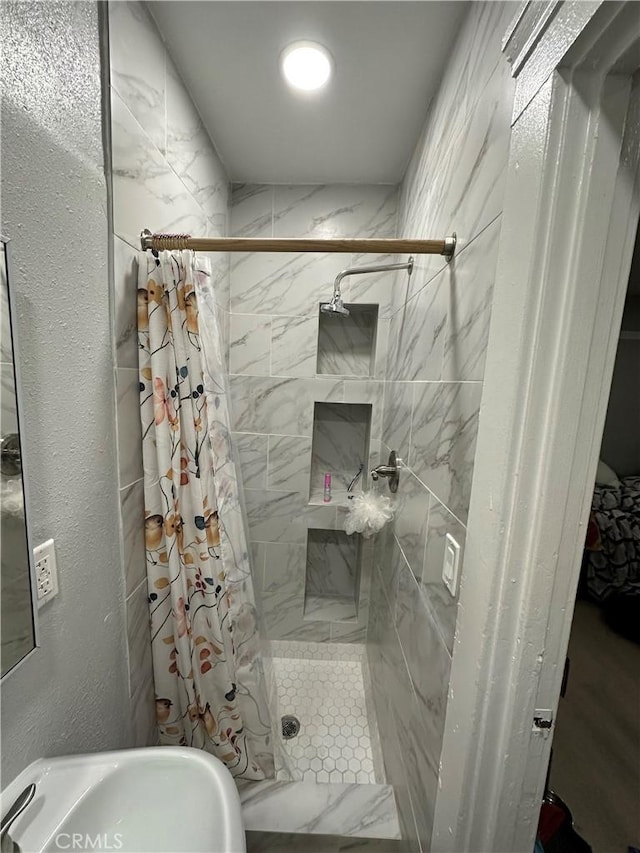 bathroom featuring sink and walk in shower