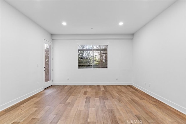 unfurnished room featuring light hardwood / wood-style floors