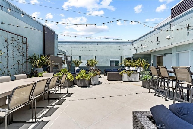 view of patio featuring an outdoor living space and exterior bar