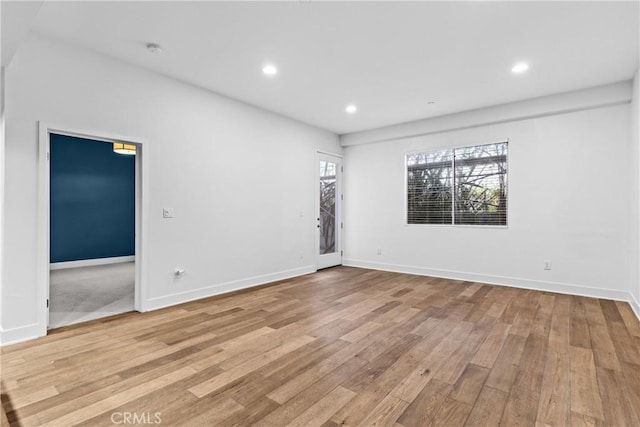 unfurnished room featuring light hardwood / wood-style flooring