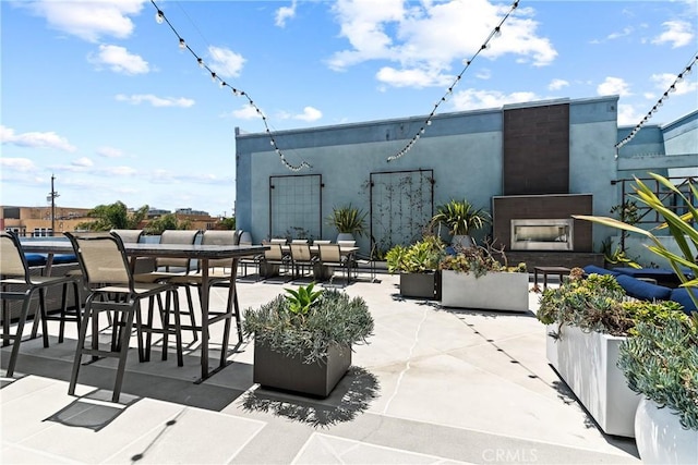 view of patio / terrace featuring a fireplace